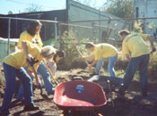 With pick-axes and shovels, VoluntEARS create the foundation for a new playground.