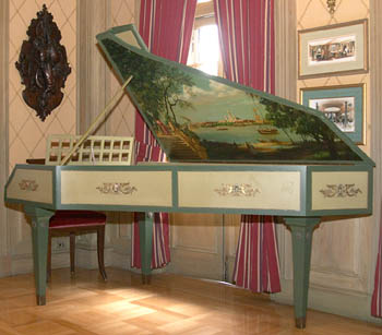 The mural on this antique harpsichord was painted by Imagineers.	