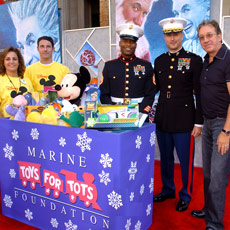 Marines and Voluntears gathered at "The Santa Clause 3" premiere to collect a bounty for Toys for Tots.