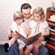 Walt the family man reads to his daughters.