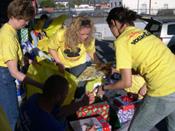 Disney VoluntEARS collect gifts for the Adopt-A-Family program.